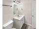 Bathroom with vanity and updated lighting at 6413 Fillian Ln, Charlotte, NC 28269