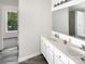 Bathroom featuring double vanity and a large mirror at 6413 Fillian Ln, Charlotte, NC 28269