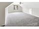 Spacious bonus room with neutral carpet and natural light at 6413 Fillian Ln, Charlotte, NC 28269