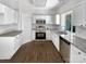 Stainless steel appliances and granite countertops in a bright kitchen space at 6413 Fillian Ln, Charlotte, NC 28269