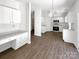 White kitchen with granite countertops and stainless steel appliances at 6413 Fillian Ln, Charlotte, NC 28269