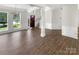 Spacious living room featuring hardwood floors and ample natural light at 6413 Fillian Ln, Charlotte, NC 28269