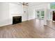 Bright living room with a fireplace and large windows at 6413 Fillian Ln, Charlotte, NC 28269