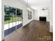 Bright living room with sliding glass door to backyard at 6413 Fillian Ln, Charlotte, NC 28269