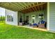 Comfortable patio setup with outdoor seating, lush green lawn and shade at 7026 Wyngate Pl, Lancaster, SC 29720
