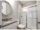 Clean bathroom features a glass enclosed shower, granite countertops, and a well-lit vanity area at 7026 Wyngate Pl, Lancaster, SC 29720