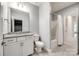 Clean bathroom with granite countertop, white cabinetry, and shower/tub combo at 7026 Wyngate Pl, Lancaster, SC 29720