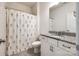 Bathroom with granite vanity, floral shower curtain, and modern fixtures at 7026 Wyngate Pl, Lancaster, SC 29720
