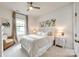 Serene bedroom with neutral tones, plush bedding, and natural light from the window at 7026 Wyngate Pl, Lancaster, SC 29720