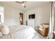 Cozy bedroom with a plush bed, a decorative chest of drawers, and a comfortable armchair at 7026 Wyngate Pl, Lancaster, SC 29720