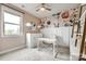 Bright bedroom features a floral accent wall, a cozy work space, and plenty of natural light at 7026 Wyngate Pl, Lancaster, SC 29720