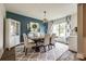 Elegant dining room with stylish decor, statement lighting, and large windows at 7026 Wyngate Pl, Lancaster, SC 29720