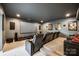 Home theater with tiered seating, a large screen, and surround sound system at 7026 Wyngate Pl, Lancaster, SC 29720