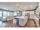 Spacious kitchen with a large island, stainless steel appliances, and open-concept living area at 7026 Wyngate Pl, Lancaster, SC 29720