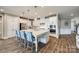 Bright kitchen boasts a large island with seating and white cabinetry, ideal for cooking and entertaining at 7026 Wyngate Pl, Lancaster, SC 29720