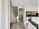 Modern kitchen with stainless steel appliances, granite counters, and hardwood floors at 7609 Holly Grove Ct, Charlotte, NC 28227