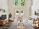 Inviting living room features high ceilings, french doors, and stylish decor at 7609 Holly Grove Ct, Charlotte, NC 28227