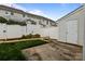 Fenced backyard featuring green grass and a concrete patio, perfect for outdoor relaxation and entertaining at 7943 Mariners Pointe Cir, Denver, NC 28037