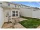 The backyard offers a cozy patio and a small grassy area, perfect for relaxation at 7943 Mariners Pointe Cir, Denver, NC 28037