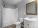 A well-maintained bathroom has a tub-shower combo, toilet, and vanity at 7943 Mariners Pointe Cir, Denver, NC 28037