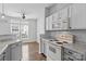 Well-lit kitchen with stainless steel appliances, light countertops, and modern fixtures at 7943 Mariners Pointe Cir, Denver, NC 28037