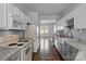 Cozy kitchen with white appliances, granite countertops, and hardwood floors at 7943 Mariners Pointe Cir, Denver, NC 28037