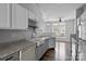 Beautiful kitchen featuring granite counters, a farmhouse sink, and modern finishes at 7943 Mariners Pointe Cir, Denver, NC 28037