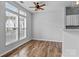 Bright living area featuring large windows, hardwood floors, and neutral paint at 7943 Mariners Pointe Cir, Denver, NC 28037