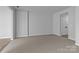 Large living room with neutral carpet at 7943 Mariners Pointe Cir, Denver, NC 28037
