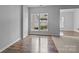 Bright living room featuring hardwood floors and large window at 7943 Mariners Pointe Cir, Denver, NC 28037