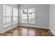 Cozy living room featuring hardwood floors and bright natural light at 7943 Mariners Pointe Cir, Denver, NC 28037