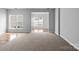 Spacious living room featuring neutral carpet and lots of natural light at 7943 Mariners Pointe Cir, Denver, NC 28037