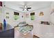 Light-filled bedroom featuring hardwood floors, natural light, and playful decor at 829 Sedgefield Rd, Charlotte, NC 28209