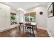 Cozy breakfast nook with views, hardwood floors, and custom built in storage at 829 Sedgefield Rd, Charlotte, NC 28209