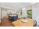 Open kitchen leading to breakfast nook features a center island, stainless appliances, and ample cabinetry at 829 Sedgefield Rd, Charlotte, NC 28209