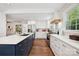 Spacious open kitchen features an island with breakfast bar, stainless appliances, and ample countertop space at 829 Sedgefield Rd, Charlotte, NC 28209