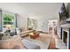 Spacious living room with hardwood floors, fireplace, and an open layout at 829 Sedgefield Rd, Charlotte, NC 28209