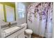 Bright bathroom with granite vanity, updated fixtures, and a patterned shower curtain at 901 Echo Glen Rd, Charlotte, NC 28213