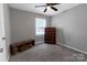 Clean bedroom with neutral walls, a ceiling fan, and plush carpeting at 901 Echo Glen Rd, Charlotte, NC 28213