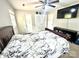 Cozy bedroom with a large flat-screen TV, stylish bedding, and ample closet space at 901 Echo Glen Rd, Charlotte, NC 28213