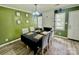 Cozy dining room with a table set for four, a fireplace, and plenty of natural light at 901 Echo Glen Rd, Charlotte, NC 28213