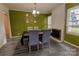 Inviting dining room with a brick fireplace and ample natural light at 901 Echo Glen Rd, Charlotte, NC 28213