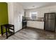 Well-lit kitchen with white cabinets, granite counters, and modern stainless steel appliances at 901 Echo Glen Rd, Charlotte, NC 28213