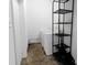 Functional laundry room includes washer, dryer, and metal shelving unit at 901 Echo Glen Rd, Charlotte, NC 28213
