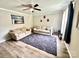 Comfortable living room featuring modern flooring, a ceiling fan, and neutral wall colors at 901 Echo Glen Rd, Charlotte, NC 28213