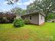 Well-maintained backyard featuring a gray home at 1004 E 8Th Ave, Gastonia, NC 28054