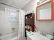 Modest bathroom featuring a tub/shower and a wood-framed mirror at 1004 E 8Th Ave, Gastonia, NC 28054