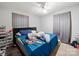 Bedroom with a black cushioned headboard and natural light at 1004 E 8Th Ave, Gastonia, NC 28054