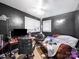 Bedroom with dark walls and a ceiling fan at 1004 E 8Th Ave, Gastonia, NC 28054