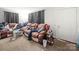 Spacious living room featuring a comfortable sofa and neutral carpet at 1004 E 8Th Ave, Gastonia, NC 28054